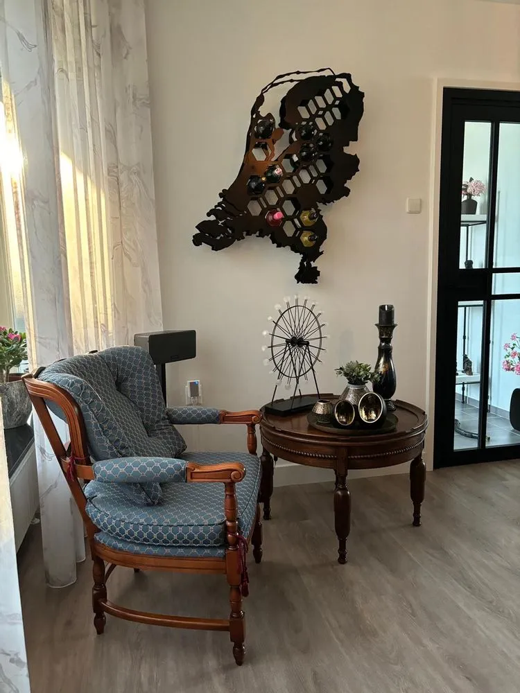 Netherlands shaped steel wall wine rack