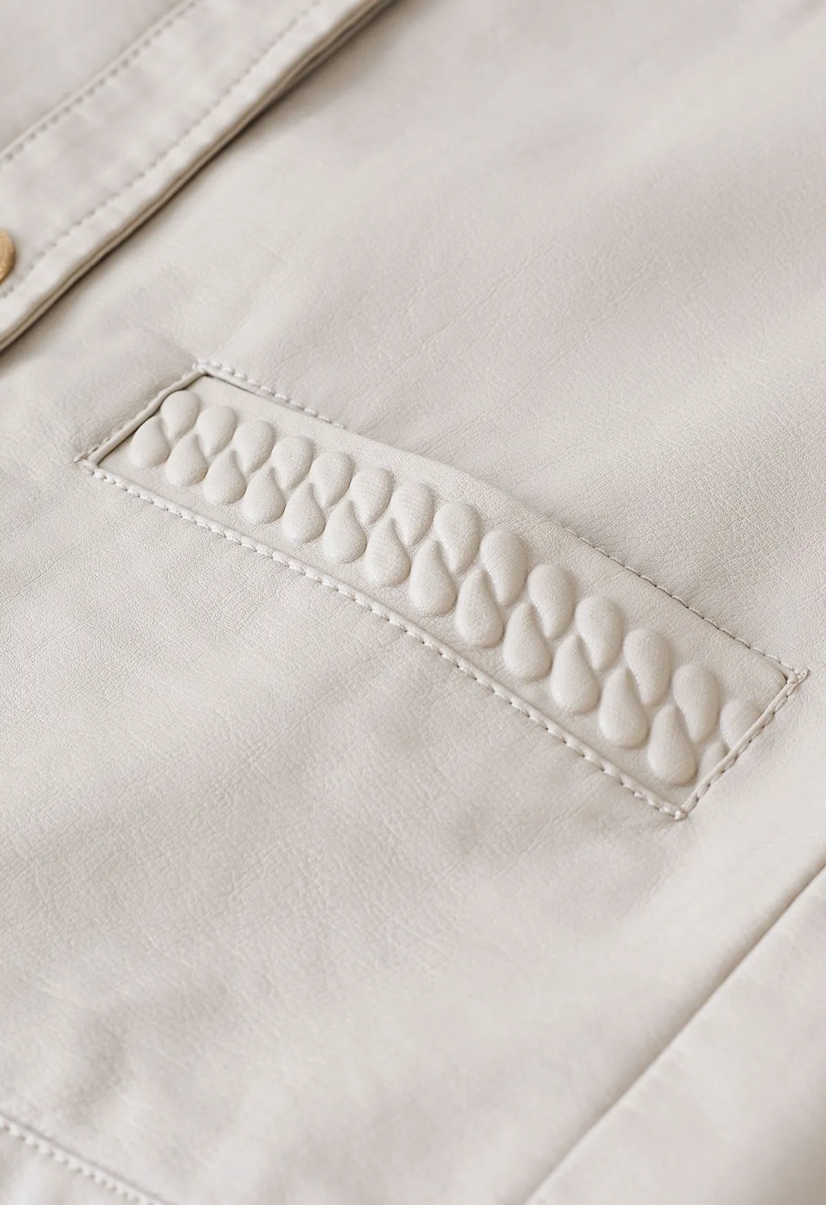 Veste en similicuir avec poches passepoilées en ivoire
